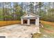 Detached garage with two bays and a spacious driveway and a fenced-in yard at 195 Blackberry Run, Fayetteville, GA 30214