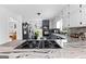 Modern kitchen featuring granite countertops, stainless steel appliances, and white and grey cabinets at 195 Blackberry Run, Fayetteville, GA 30214