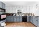 Well-lit kitchen with granite countertops and ample cabinet space at 195 Blackberry Run, Fayetteville, GA 30214