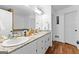 Bright bathroom with granite countertops, hardwood floors, and double sinks at 195 Blackberry Run, Fayetteville, GA 30214