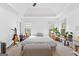 Bright main bedroom featuring a tray ceiling, neutral décor, and ample natural light at 195 Blackberry Run, Fayetteville, GA 30214