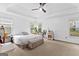 Spacious main bedroom with tray ceiling, large windows, and neutral tones at 195 Blackberry Run, Fayetteville, GA 30214