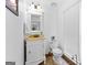 Cozy powder room featuring elegant vanity and flooring at 195 Blackberry Run, Fayetteville, GA 30214