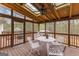 Inviting sunroom with a ceiling fan, skylights, and a seating area overlooking the backyard at 195 Blackberry Run, Fayetteville, GA 30214