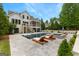 Backyard with swimming pool and hot tub, outdoor seating, and professional landscaping at 215 Sheridan Ln, Peachtree City, GA 30269
