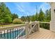 Backyard deck offers views of the pool area and verdant landscaping, creating a serene outdoor oasis at 215 Sheridan Ln, Peachtree City, GA 30269