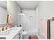 Bright bathroom featuring a white subway tiled shower with a built-in niche and a sleek, modern vanity at 215 Sheridan Ln, Peachtree City, GA 30269