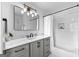 Nicely designed bathroom with tile shower, gray vanity, and stylish lighting at 215 Sheridan Ln, Peachtree City, GA 30269