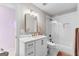 Bathroom with updated vanity, mirror, and tiled shower at 215 Sheridan Ln, Peachtree City, GA 30269