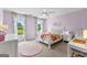 Comfortable ' bedroom with windows, desk, and ceiling fan at 215 Sheridan Ln, Peachtree City, GA 30269
