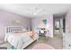 Well-lit bedroom with a ceiling fan and desk with seating at 215 Sheridan Ln, Peachtree City, GA 30269