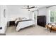 Bright bedroom features a ceiling fan, windows with shutters, and tasteful decor for a relaxing atmosphere at 215 Sheridan Ln, Peachtree City, GA 30269