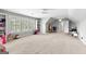 Versatile bonus room with cozy seating, custom shelving, and a dedicated study area for work or hobbies at 215 Sheridan Ln, Peachtree City, GA 30269