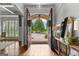 Inviting entryway with hardwood floors, arched doorways, and natural light at 215 Sheridan Ln, Peachtree City, GA 30269