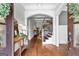 Grand entrance foyer with hardwood floors, decorative molding, and a staircase at 215 Sheridan Ln, Peachtree City, GA 30269