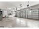 Spacious three-car garage with an epoxy floor and ample storage space, suitable for multiple vehicles at 215 Sheridan Ln, Peachtree City, GA 30269