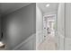 Hallway with carpeted floor and doorway leading to a bedroom at 215 Sheridan Ln, Peachtree City, GA 30269