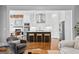 Modern kitchen open to the living area featuring a large island and stainless steel appliances at 215 Sheridan Ln, Peachtree City, GA 30269