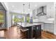 Kitchen featuring island with seating, modern cabinetry, and stainless steel appliances at 215 Sheridan Ln, Peachtree City, GA 30269