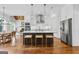 Contemporary kitchen with a large island, stainless appliances, and open layout to the dining area at 215 Sheridan Ln, Peachtree City, GA 30269