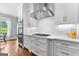 Bright kitchen featuring stainless steel appliances, marble countertops and hardwood floors at 215 Sheridan Ln, Peachtree City, GA 30269