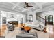 Spacious living room with views of the kitchen, staircase, and elegant entryway at 215 Sheridan Ln, Peachtree City, GA 30269
