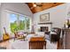 Cozy living room with hardwood floors, vaulted ceilings and a fireplace at 215 Sheridan Ln, Peachtree City, GA 30269