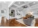 Bright and airy living room with coffered ceilings and hardwood flooring at 215 Sheridan Ln, Peachtree City, GA 30269