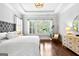 Bright main bedroom with tray ceiling, hardwood floors and lots of natural light at 215 Sheridan Ln, Peachtree City, GA 30269