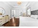 Bright main bedroom with hardwood floors and tray ceiling at 215 Sheridan Ln, Peachtree City, GA 30269