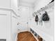 Organized mudroom with a built-in bench, storage, and shelving, perfect for keeping items tidy at 215 Sheridan Ln, Peachtree City, GA 30269