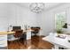Bright home office with hardwood floors, stylish lighting and built-in desk perfect for working from home at 215 Sheridan Ln, Peachtree City, GA 30269