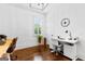 Bright home office with hardwood floors, stylish lighting and multiple desks at 215 Sheridan Ln, Peachtree City, GA 30269