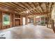 Unfinished basement with exposed framing and insulation, providing an opportunity to customize and add value at 215 Sheridan Ln, Peachtree City, GA 30269