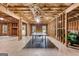 Large unfinished basement with exposed insulation and framing, offering ample space for personalization and storage at 215 Sheridan Ln, Peachtree City, GA 30269