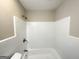 Clean bathroom with white tiled shower/tub combination at 6507 Jackie Ln, Austell, GA 30106