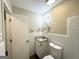 Clean bathroom with a tile surround vanity and a bright vanity light at 6507 Jackie Ln, Austell, GA 30106