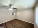 Cozy bedroom featuring hardwood floors and a ceiling fan with light at 6507 Jackie Ln, Austell, GA 30106