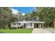 Charming ranch-style home featuring a well-maintained lawn and a covered carport at 6507 Jackie Ln, Austell, GA 30106
