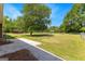 Large backyard featuring ample green space, trees, and an outbuilding at 270 Lake Cir, Fayetteville, GA 30215