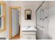 Bright bathroom featuring a vanity with sink and a glass enclosed shower stall at 270 Lake Cir, Fayetteville, GA 30215