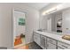 A well-lit bathroom with a white countertop, a large mirror, and access to the shower and toilet at 270 Lake Cir, Fayetteville, GA 30215