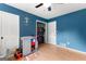 bedroom featuring a changing table, a ceiling fan, closet access and toys at 270 Lake Cir, Fayetteville, GA 30215
