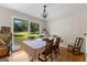 Bright dining area with a large window, classic chandelier, and hardwood floors at 270 Lake Cir, Fayetteville, GA 30215