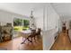 Traditional dining room featuring hardwood floors, classic furnishings, and a large window overlooking the front yard at 270 Lake Cir, Fayetteville, GA 30215