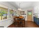 Cozy dining nook featuring warm lighting, hardwood floors, and large windows at 270 Lake Cir, Fayetteville, GA 30215