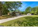 Long driveway leading to a charming home with a detached garage and ample parking space at 270 Lake Cir, Fayetteville, GA 30215