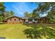 Charming single-story brick home with a lush lawn and mature trees creating a peaceful setting at 270 Lake Cir, Fayetteville, GA 30215