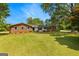 Beautifully maintained single-story brick house featuring a well-manicured lawn and mature trees at 270 Lake Cir, Fayetteville, GA 30215