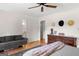 This main bedroom offers a lovely couch, wooden floors, ceiling fan, and decorative dresser at 270 Lake Cir, Fayetteville, GA 30215